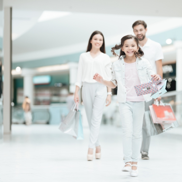 couple-with-daughter-are-walking-shopping-mall